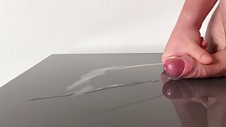 Huge cumshot on reflecting table after days of edging