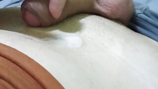 Masturbates his cock, strokes his balls and ends up with juicy cum