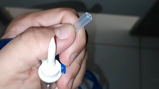 Preparing the stick for application of the serum directly into the glans vein.