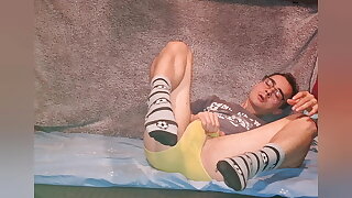 I was playing with my cock after school, wearing yellow underwear and socks which I've covered with cum!