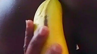 Young college twink inserted a huge banana in his asshole and spread his oiled ass