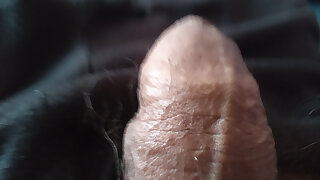 Young man in close-up of his cute oiled penis